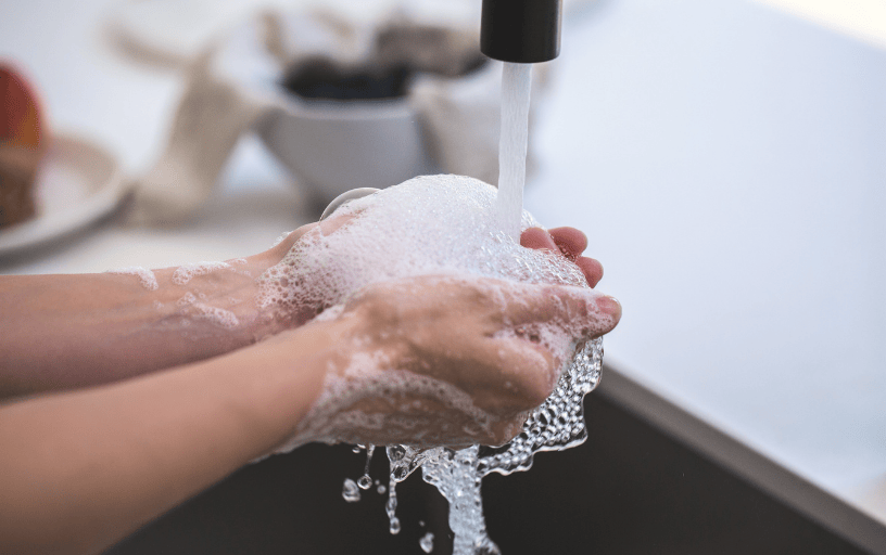 woman washing hands on a modern sink